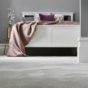 carpet and white bed